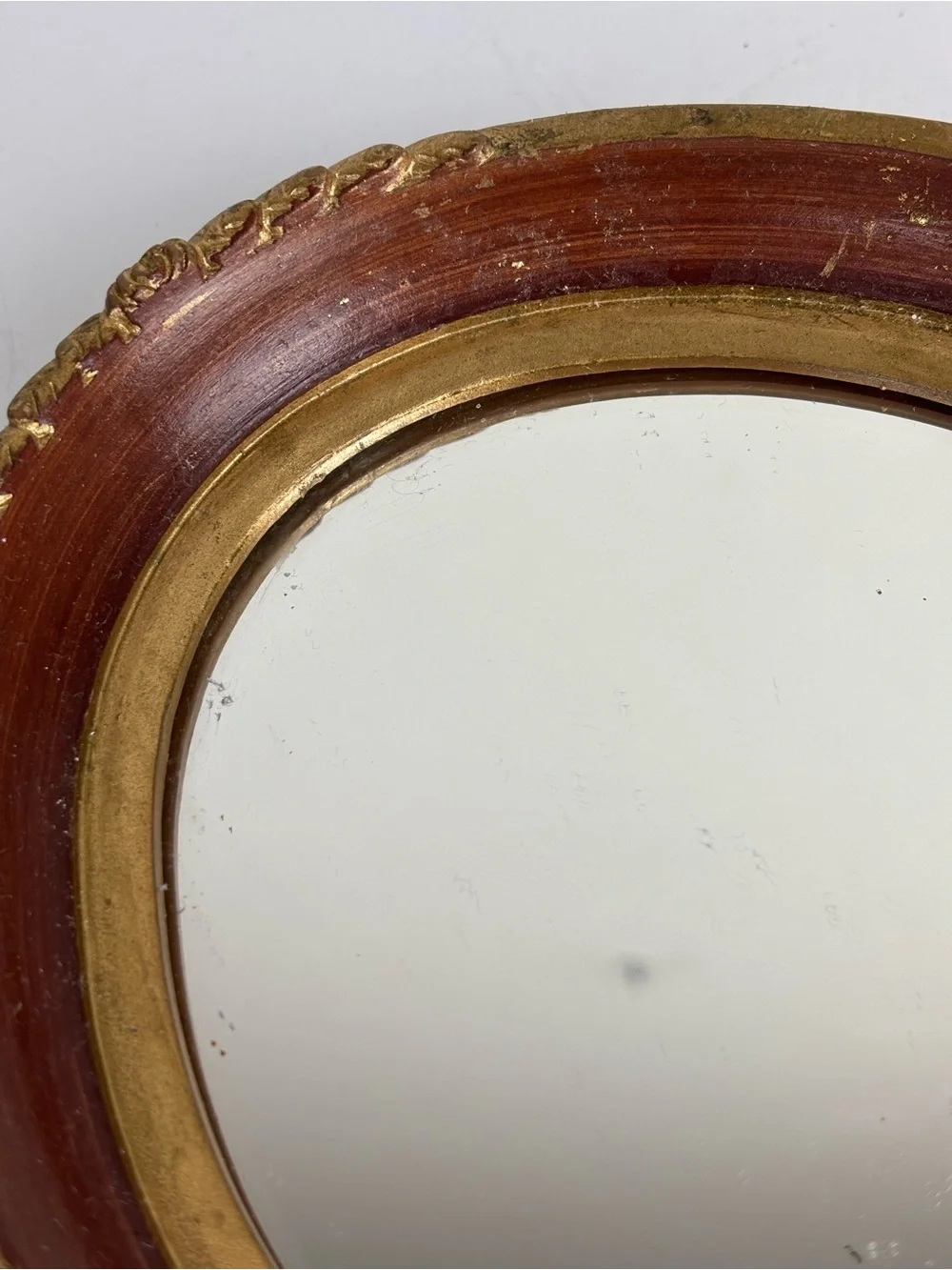 Small vintage oval wall mirror-gold /garnet red